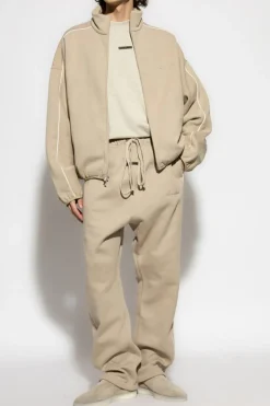 Fear Of God Essentials beżowy Dresowe spodnie z lampasami