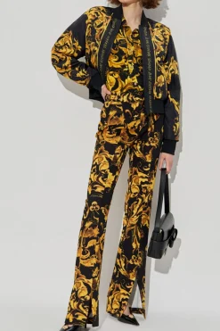 Versace Jeans Couture ŻÓŁTY Spodnie z rozszerzanymi nogawkami z rozcięciem